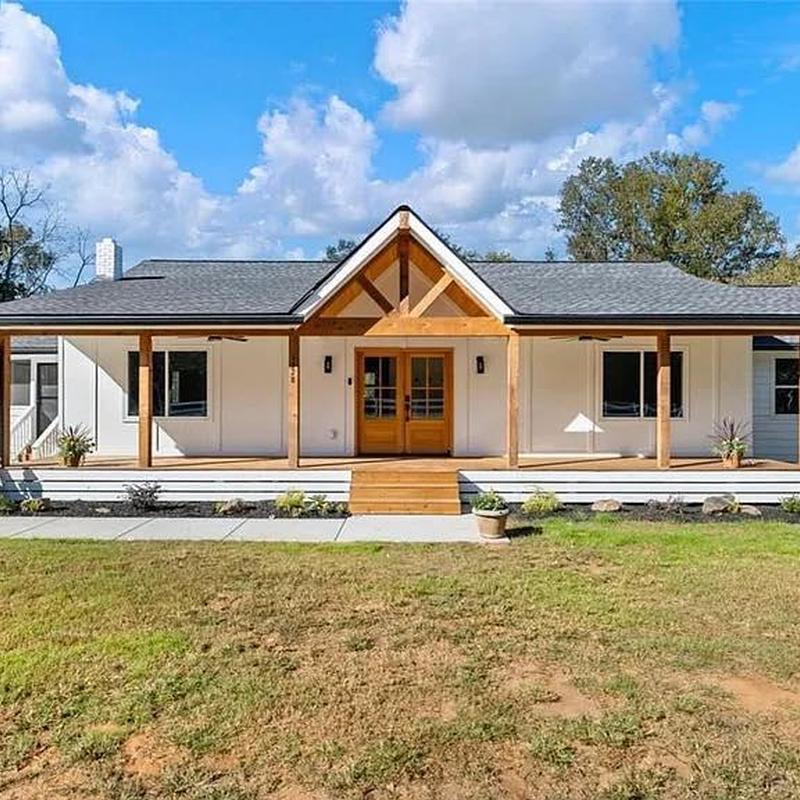 Asphalt shingle roof on modern farmhouse exterior