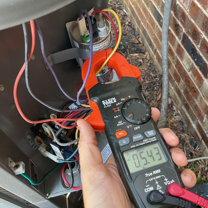 AC unit electrical connections with clamp meter testing