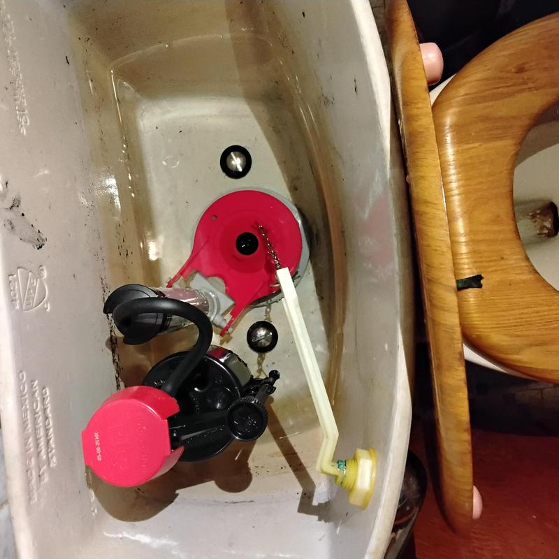 Toilet tank flush valve and fill valve assembly detail
