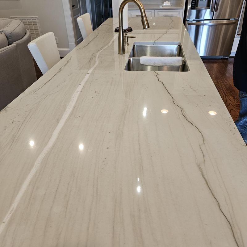 Quartz kitchen island countertop with sink and faucet