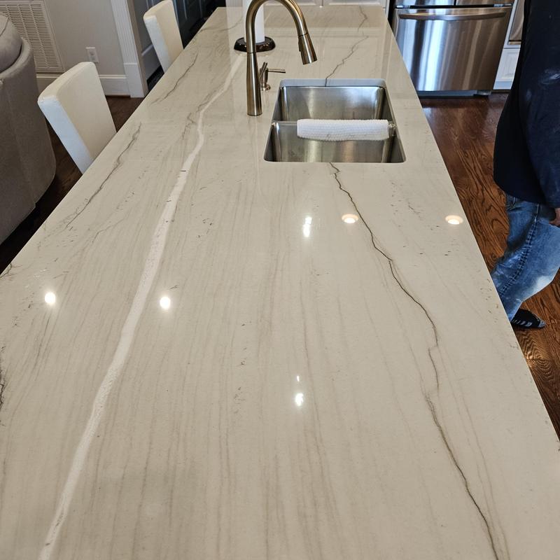 Quartz kitchen island countertop with sink and faucet