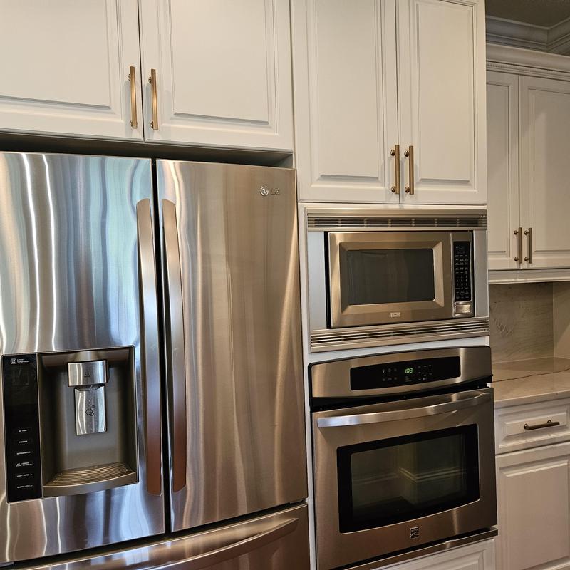 Stainless steel refrigerator, microwave, and oven installation