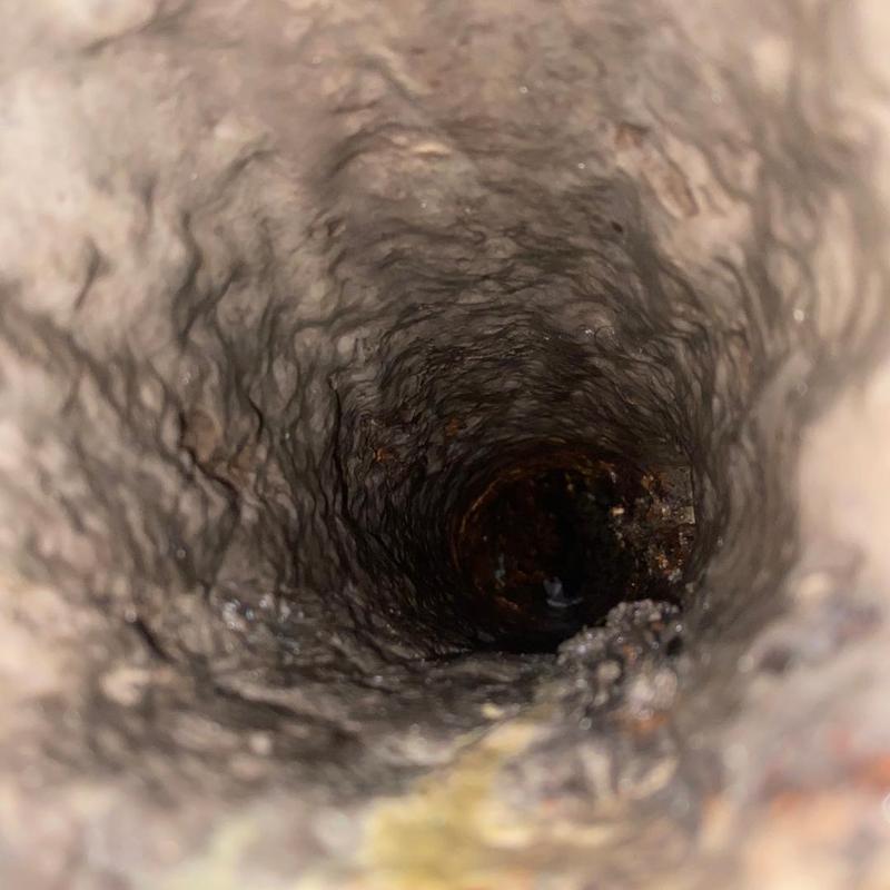 Main sewer line interior before cleaning service