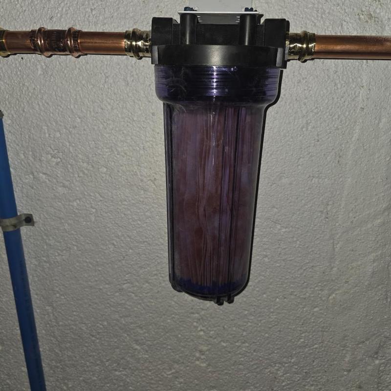 Particle filter housing with copper piping installation