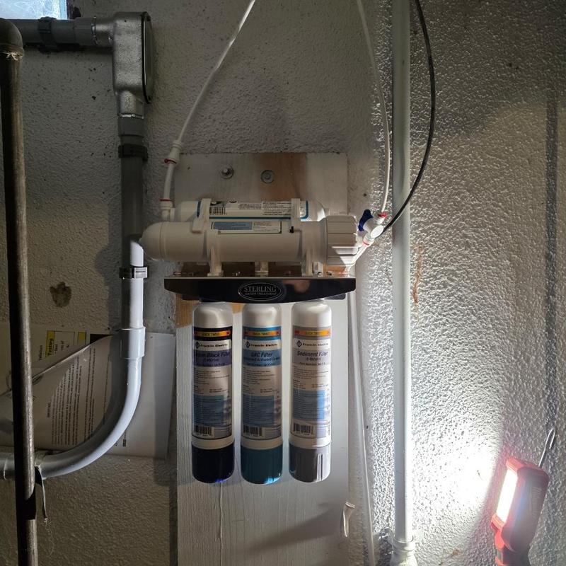 Reverse osmosis water filtration system installed in basement