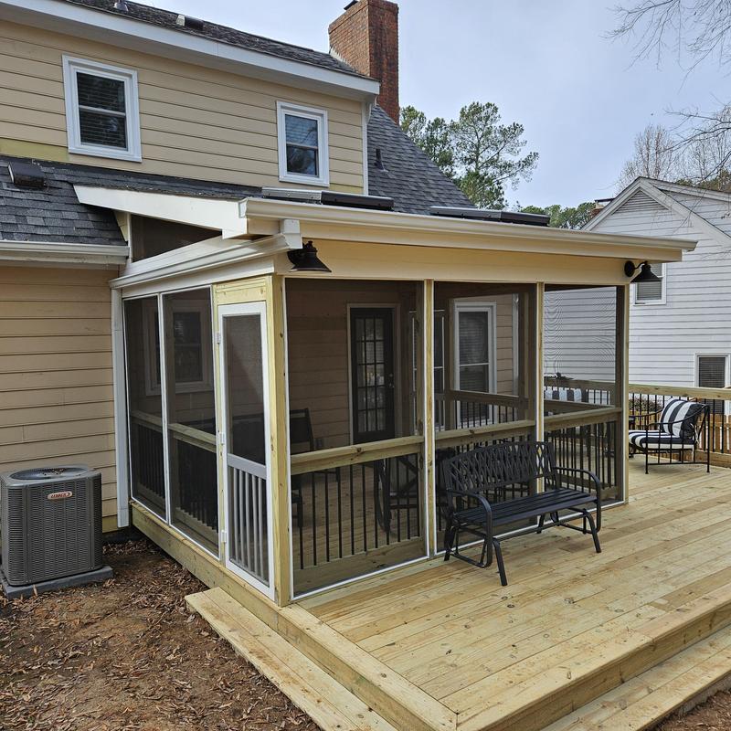 Screened porch enclosure on new wooden deck