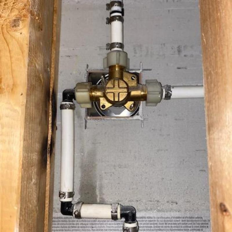 Shower valve with PEX piping installation in wall cavity