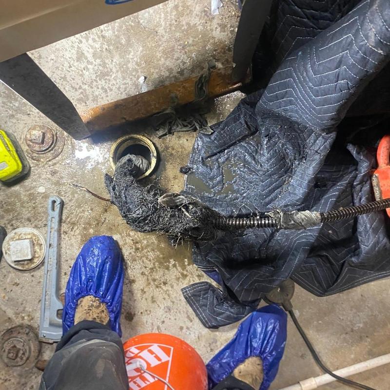 Drain line clog removal using plumbing snake and jetter