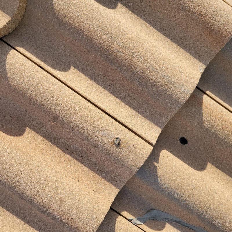 Concrete tile roof with solar heater penetration holes