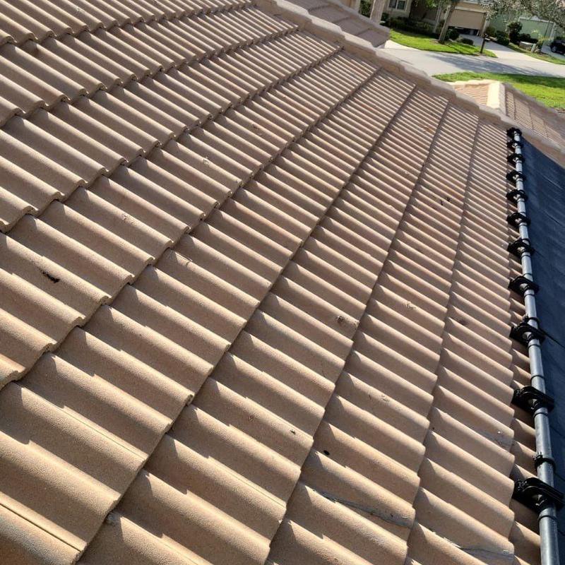 Concrete tile roof with cracked and patched tiles