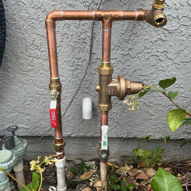 Pressure regulator and copper piping for water supply system