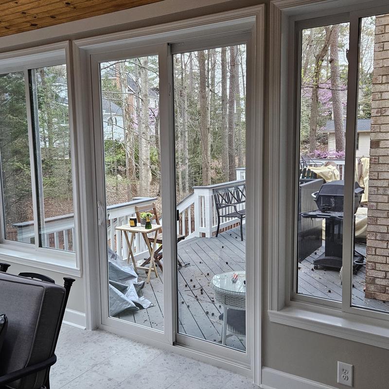 Sliding glass door installation with deck view