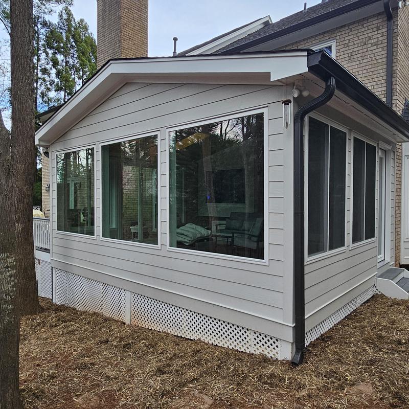 Sunroom windows and siding exterior home addition