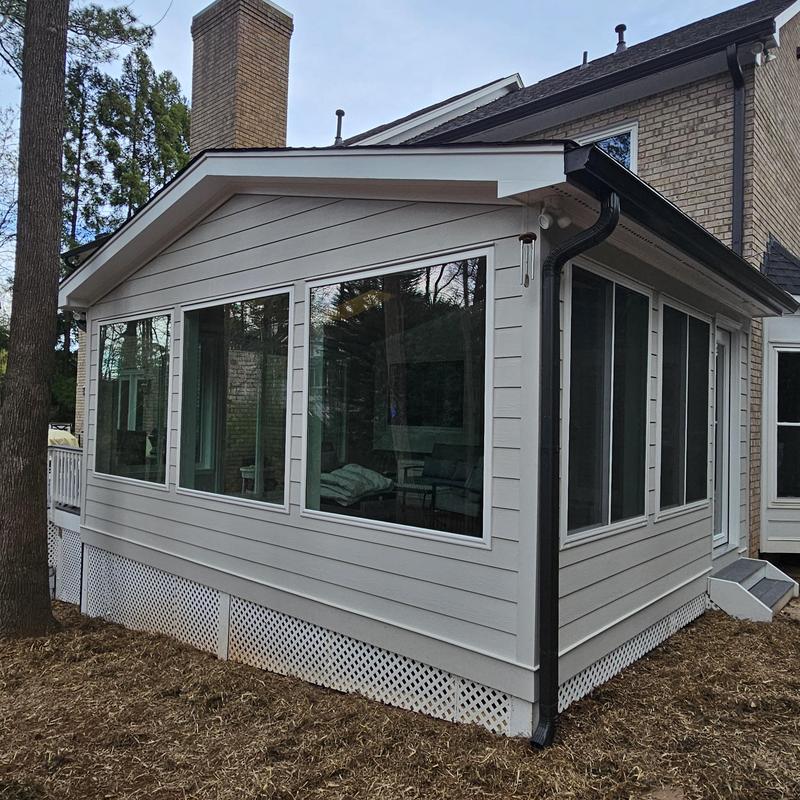 Home addition with siding and large windows