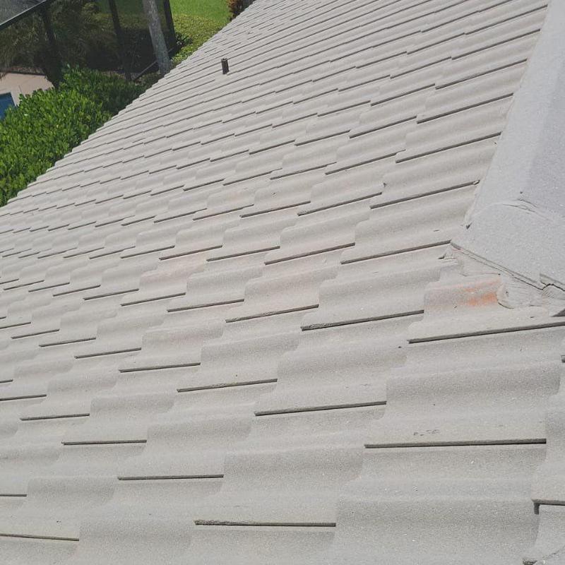 Tile roof with damaged and mismatched repairs in Fort Myers