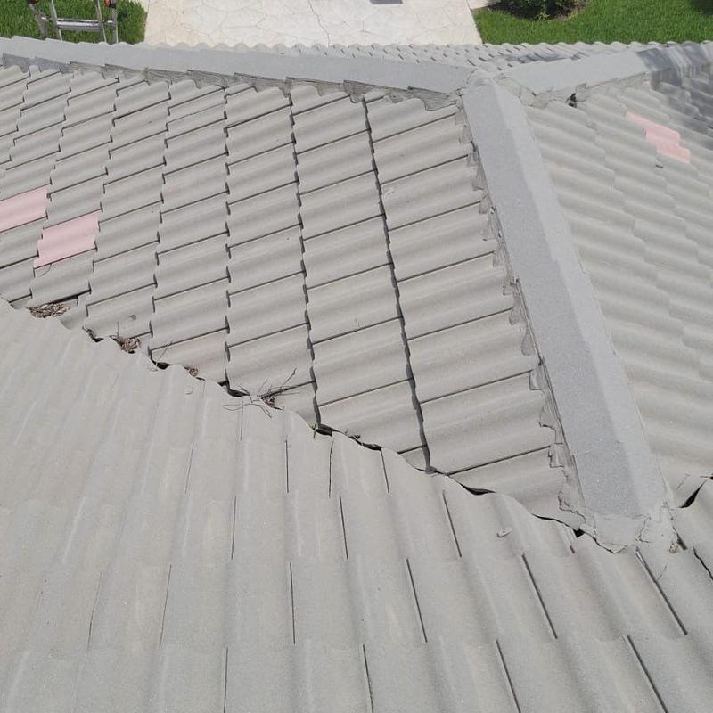 Tile roof with damaged and mismatched repair tiles