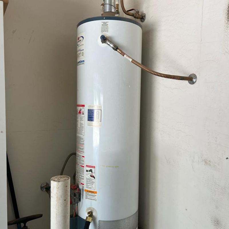 40-gallon gas water heater with new supply lines installed