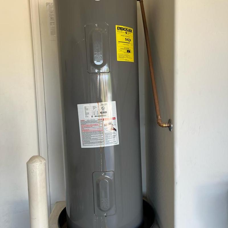 50-gallon electric water heater with corrosion damage