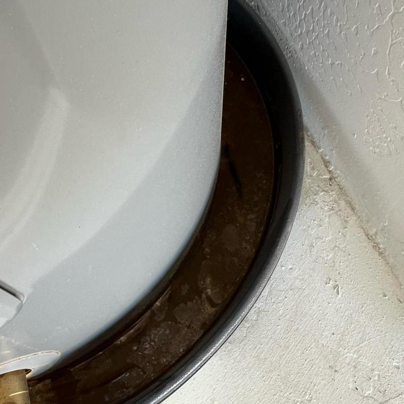 50-gallon electric water heater with rusted drain pan
