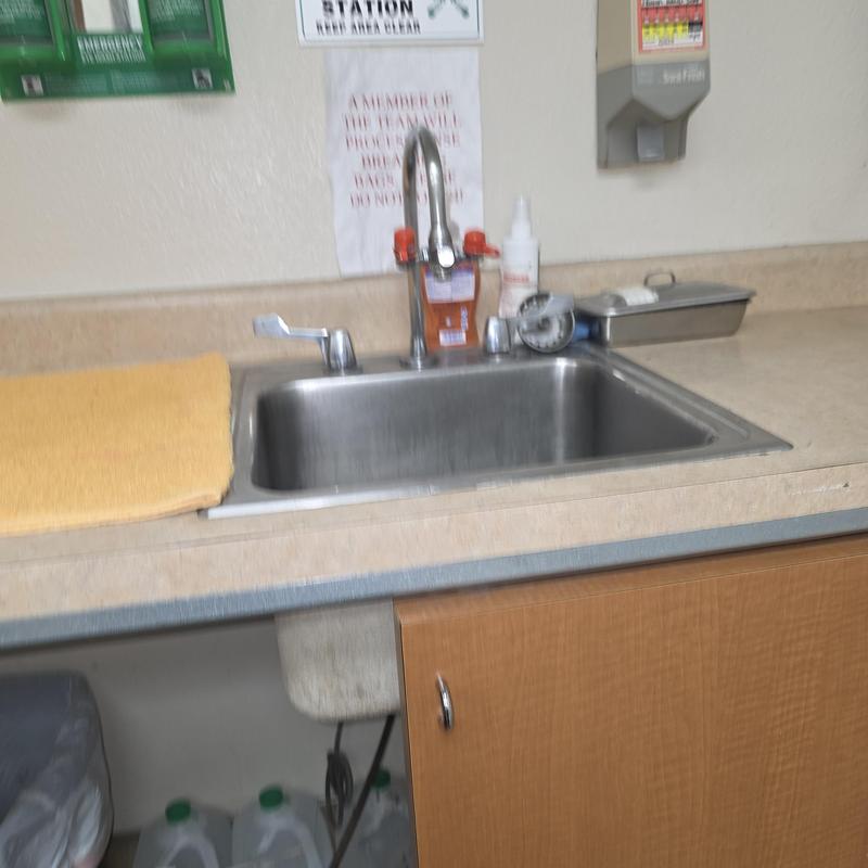 Commercial sink with faucet and soap dispensers
