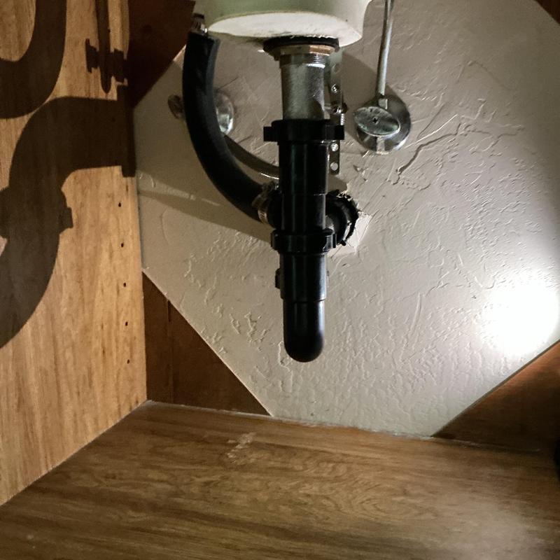 P-trap installation under sink with metal fittings P-trap installation under sink with metal fittings