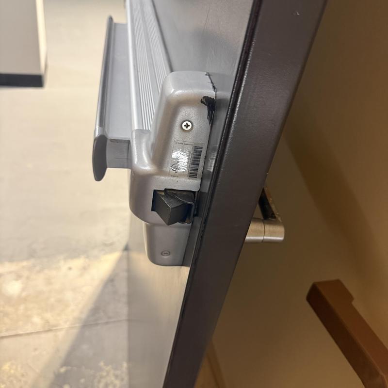 Panic exit hardware on commercial stairwell door close-up Panic exit hardware on commercial stairwell door close-up