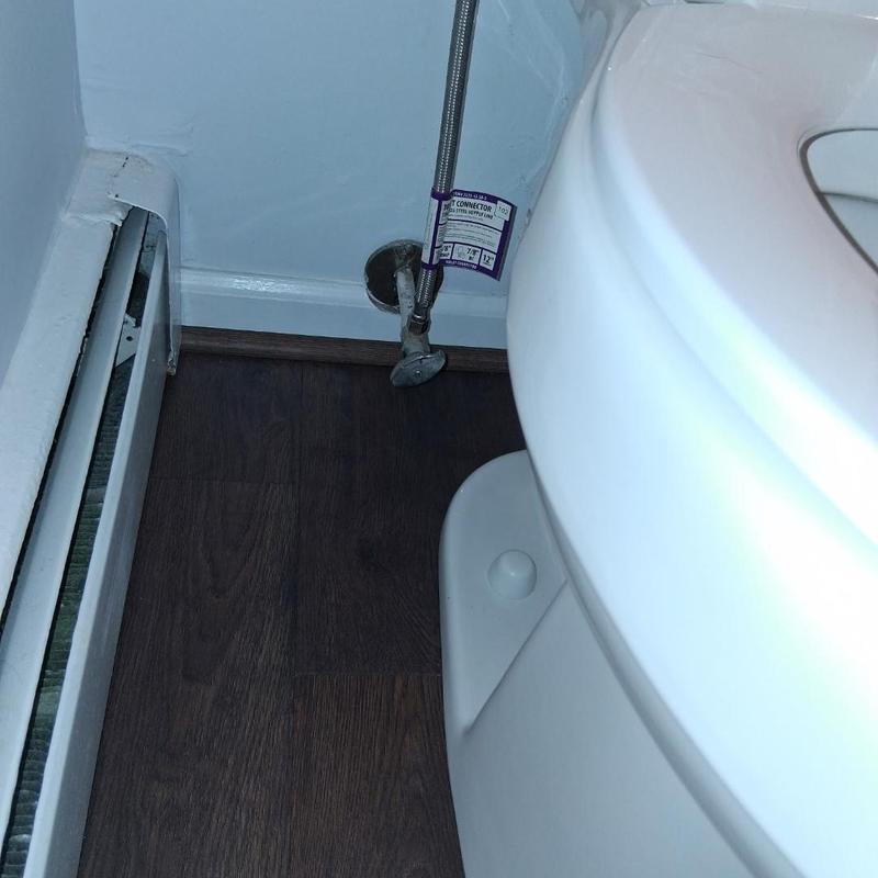 Toilet stop valve and supply line installation near baseboard heater