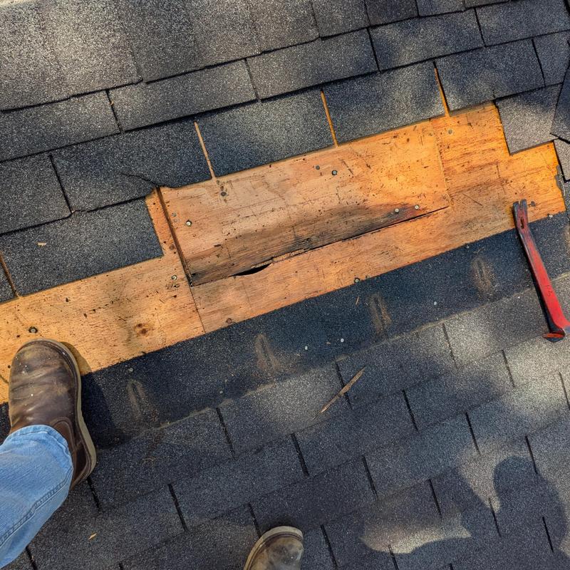 Roof sheathing wood with damaged section cut out