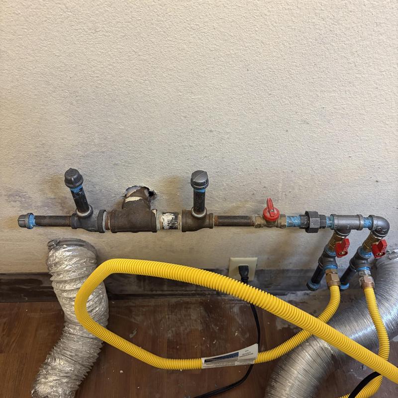 Dryer gas line and vent tubing installation in common area