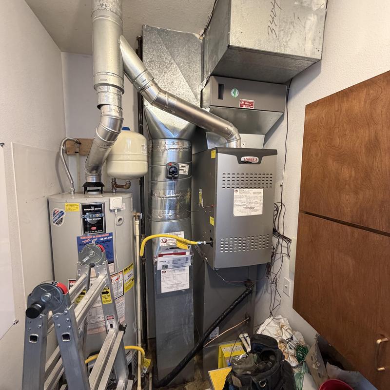 Furnace wiring and capacitor repair in utility room