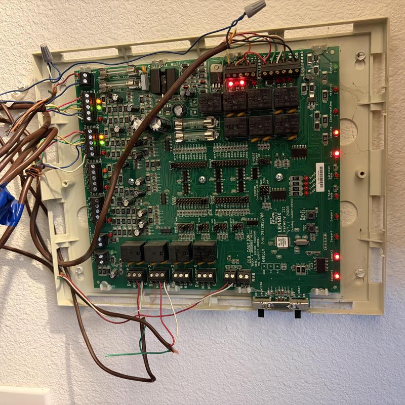 HVAC zone control board with wiring and LED indicators