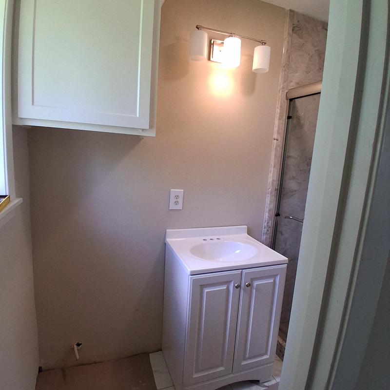 Vanity with cultured marble sink and vanity lights
