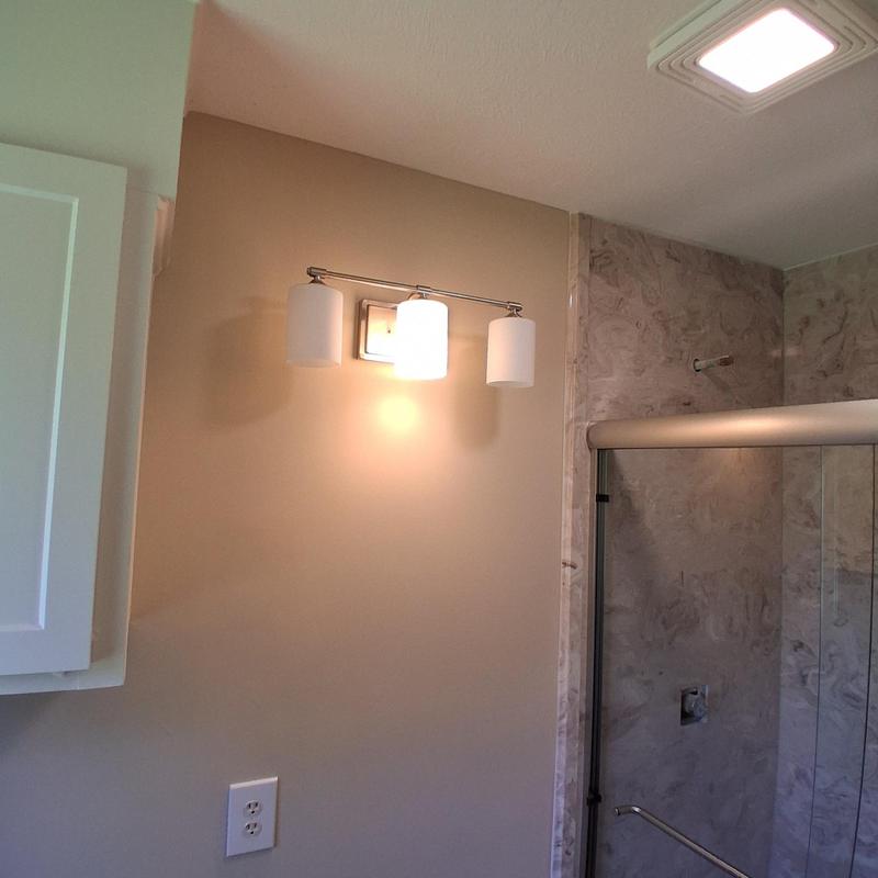 Vanity light fixture and switch cover installation