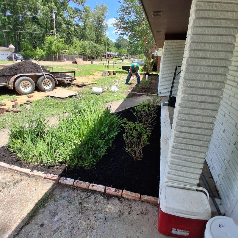 Flower bed landscaping with fresh mulch installation