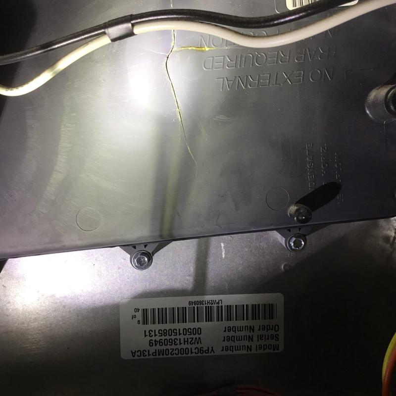 Furnace component with visible crack near wiring