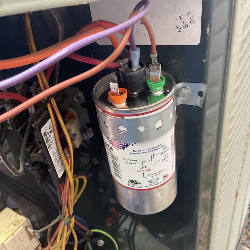 HVAC capacitor with connected electrical wiring