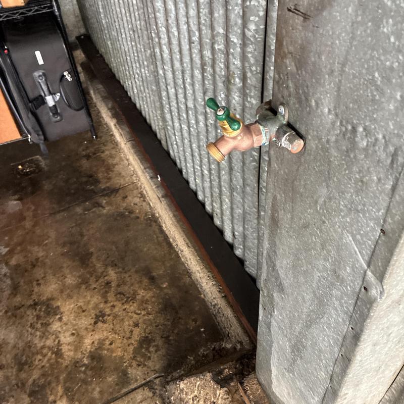 Hose bib installation on exterior metal siding wall Hose bib installation on exterior metal siding wall