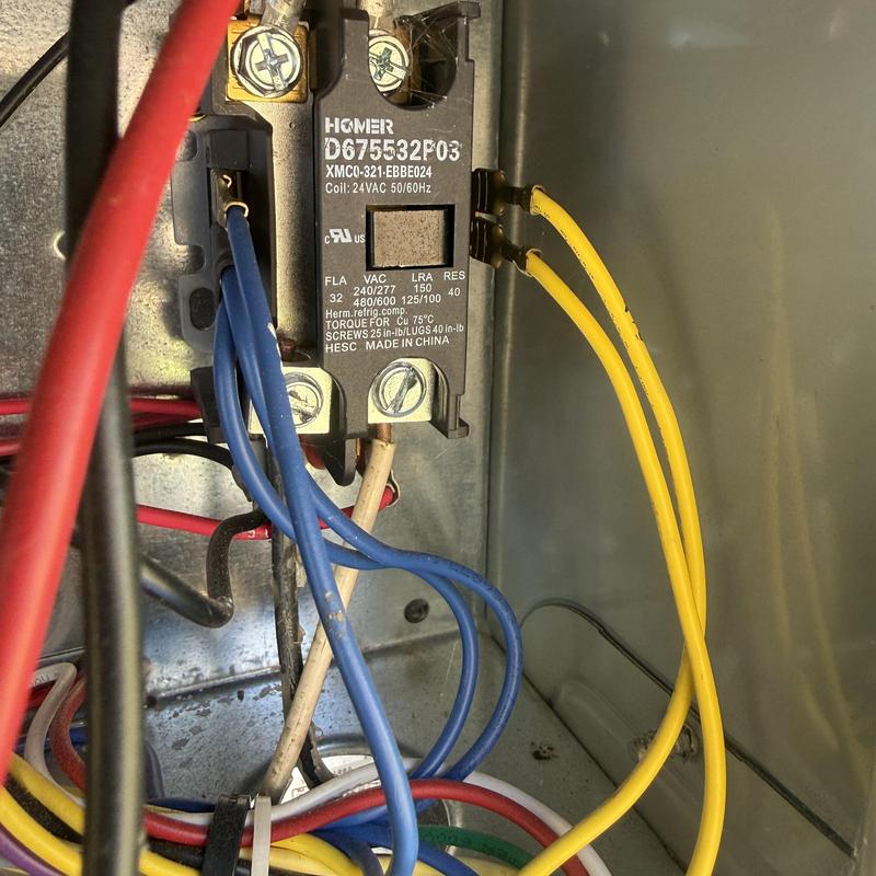 Electrical relay with blue and yellow wiring connected Electrical relay with blue and yellow wiring connected