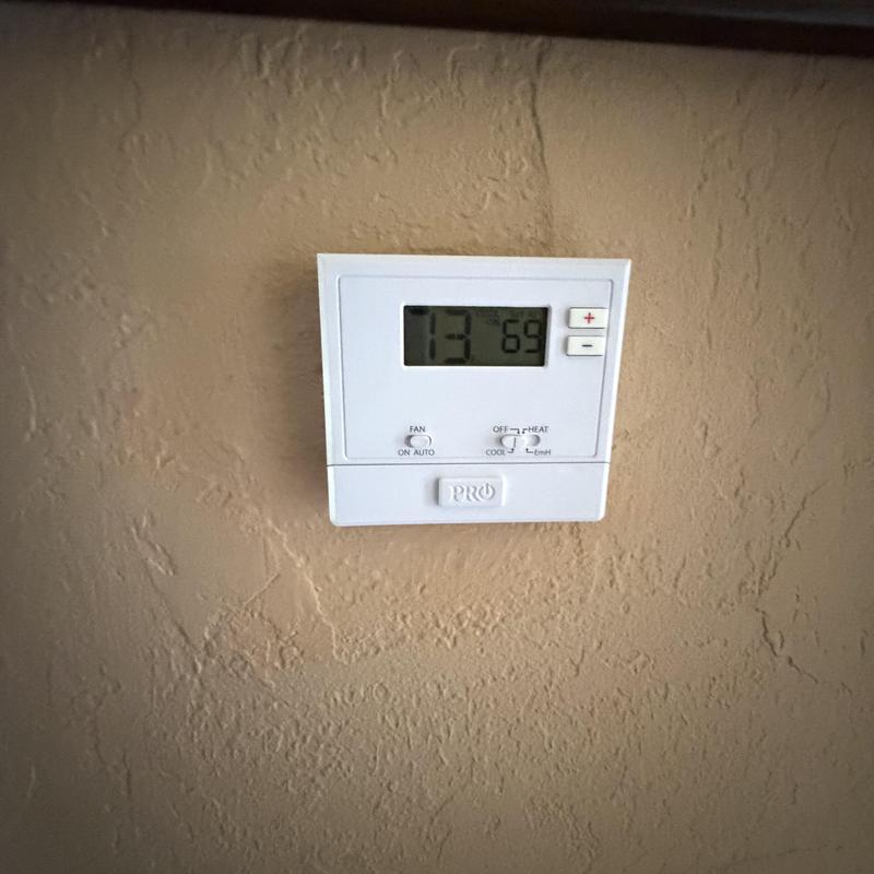 Thermostat display showing temperature and settings
