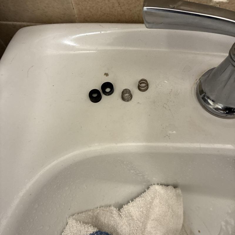 Delta faucet seat and spring assembly parts on sink Delta faucet seat and spring assembly parts on sink