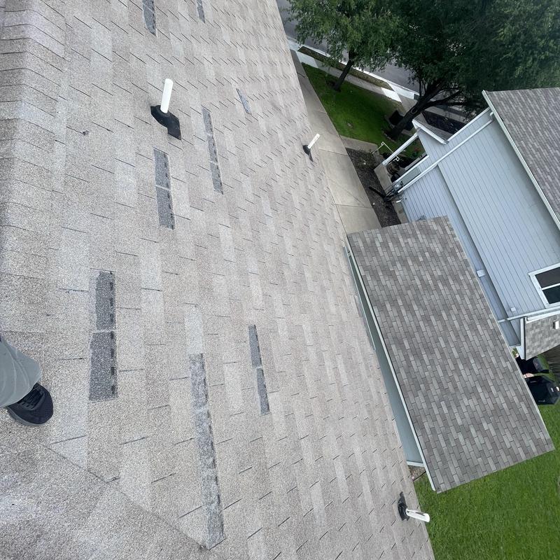 Roof shingles missing on residential roof slopes and garage