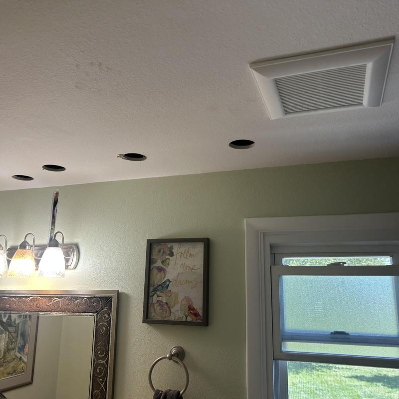 Bathroom exhaust fan installation with ceiling holes