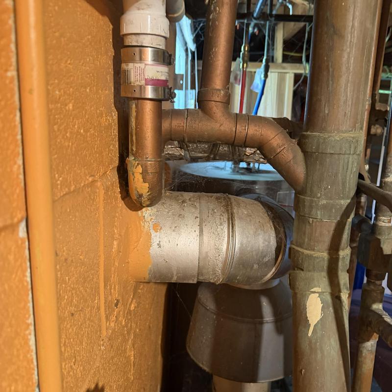 Copper plumbing pipes with metal vent pipe connection Copper plumbing pipes with metal vent pipe connection