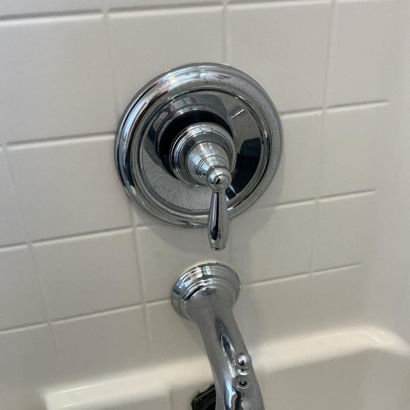 Shower and tub trim with installed tub spout