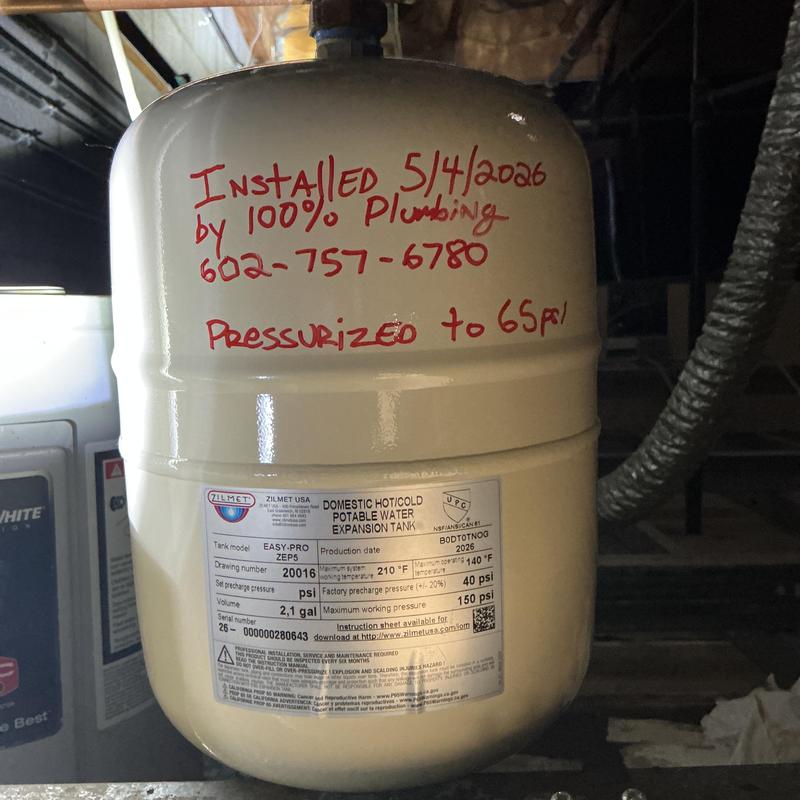 Thermal expansion tank with installation date and pressure notes Thermal expansion tank with installation date and pressure notes