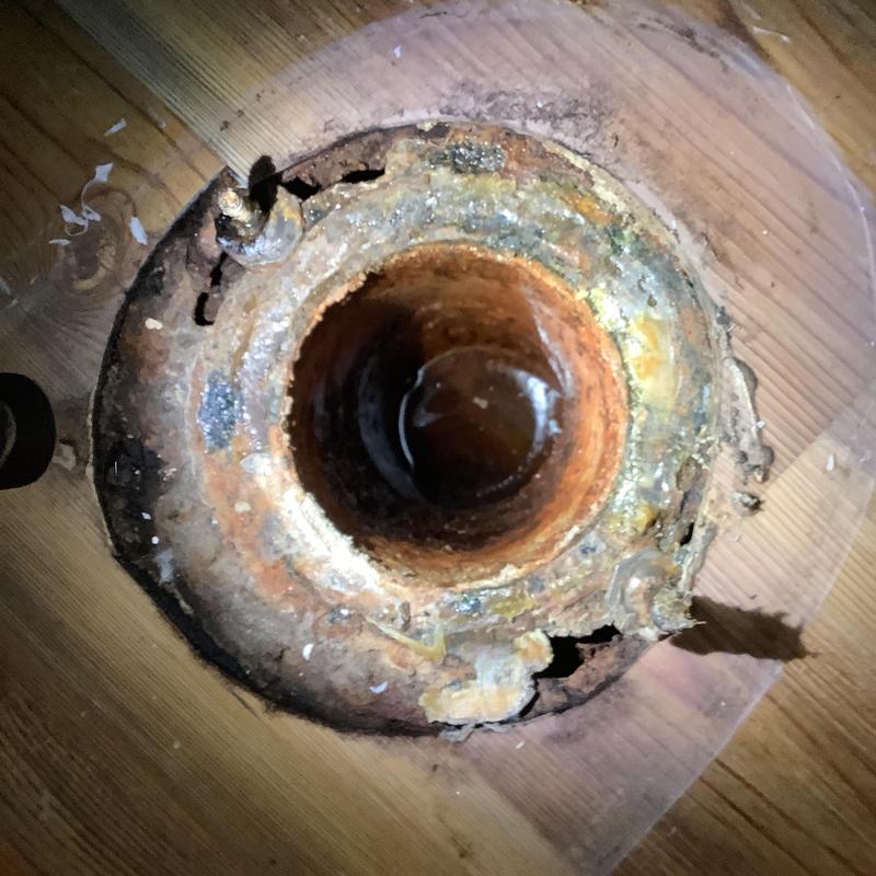 Main drain line flange rust and corrosion close-up Main drain line flange rust and corrosion close-up