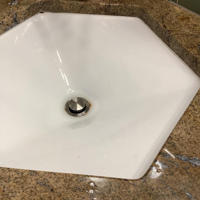 Lavatory sink pop-up drain assembly on granite counter Lavatory sink pop-up drain assembly on granite counter