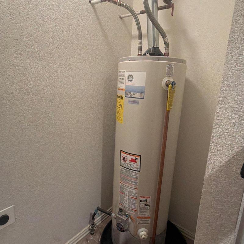 Water heater with updated piping and permits installed