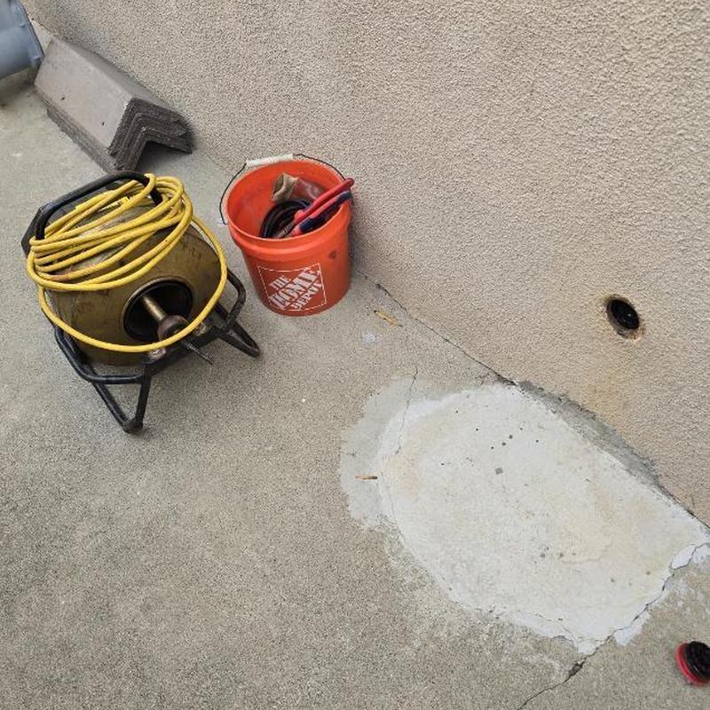 Kitchen drain clean-out with drain snake and tools