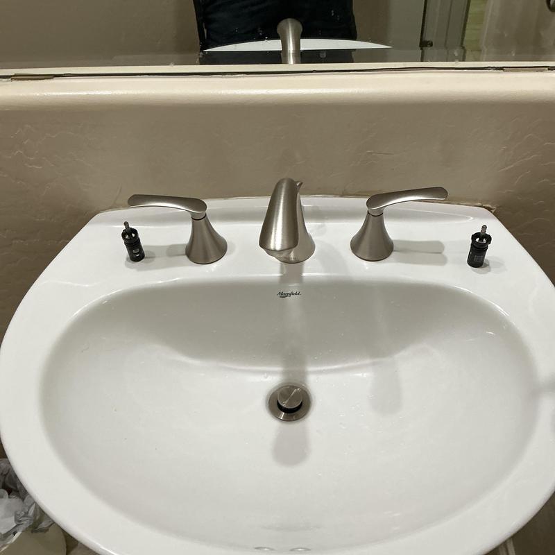 Moen two-handle bathroom faucet with cartridge removed Moen two-handle bathroom faucet with cartridge removed
